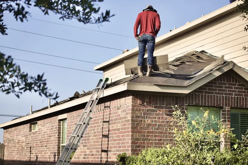 Professional roofer working on a residential roof in Pendleton